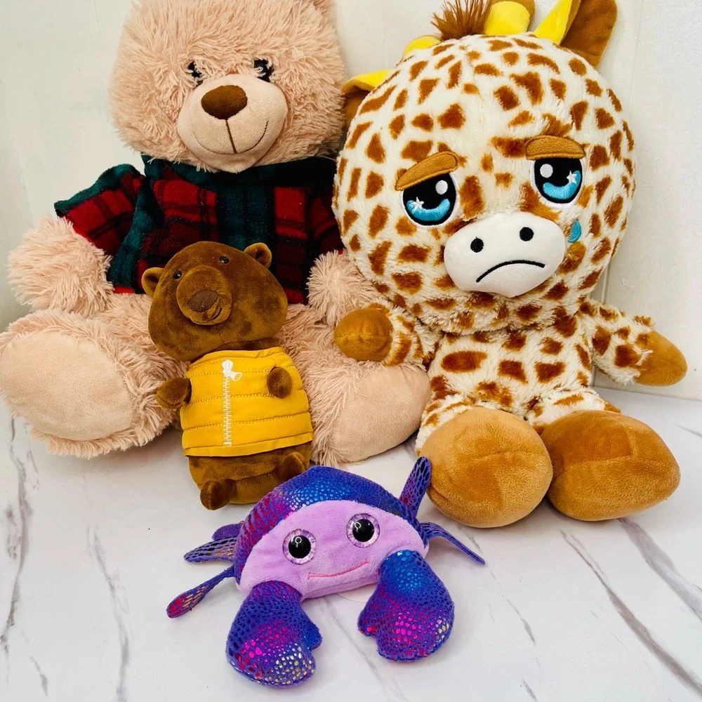A lot of four Plush Giraffe, Tadebeare, Pig, and Fish Toy Set